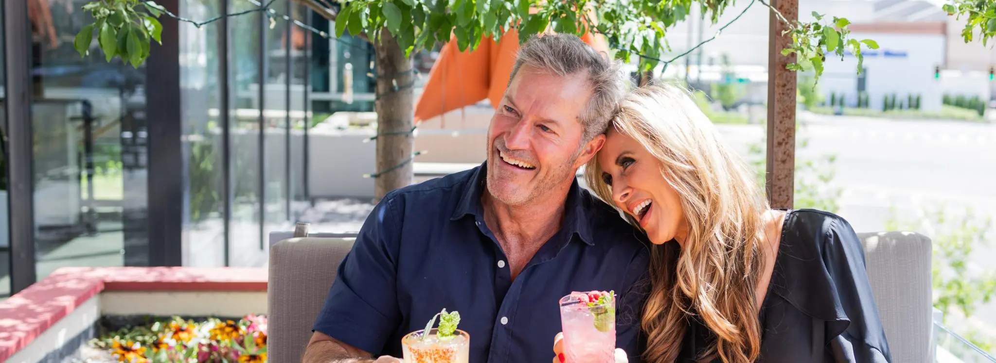 Smiling couple with cocktails