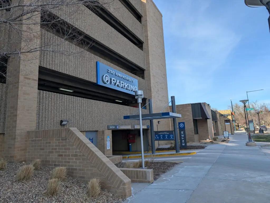 210 University Garage parking entrance with the parking sign and "Enter" signs visible on a sunny day.