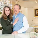 Foster & Son Fine Jewelers owners smiling in their store.