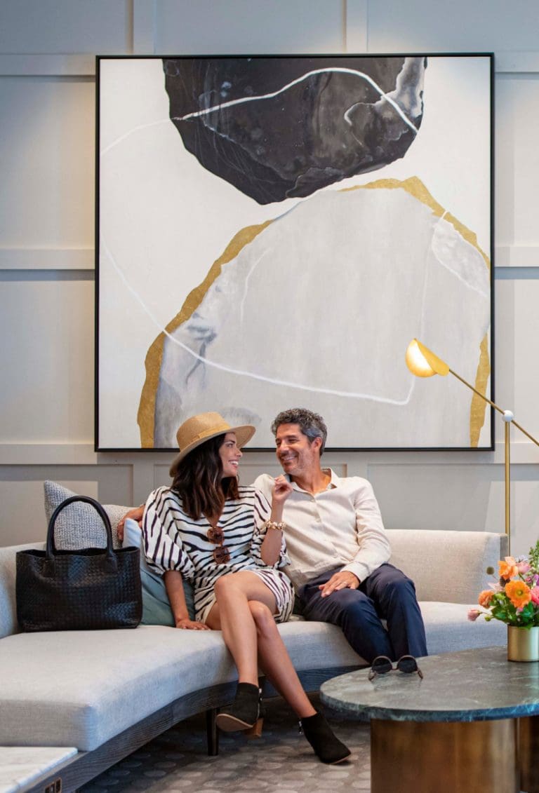 People smiling on couch