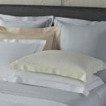 Luxurious bed with premium sheets from The Brass Bed collection.