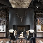 Frye store interior with fireplace, seating, and boot displays.