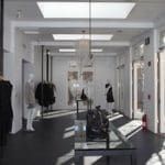 Interior view of MAX Clothing Store with clothing racks and mannequins.
