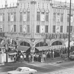 Gart Bros Sports Castle in Denver, Colorado, with a long line of customers outside the entrance.