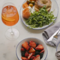 Mother's Day brunch: bagel, smoked salmon, fruit salad, and aperol spritz