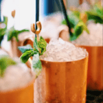 Mint Juleps in copper mugs, perfect for Derby Day at Rare Bird Rooftop Bar.