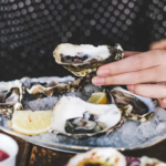 Fresh oysters on ice with lemon wedges, a Mother's Day treat