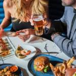 Couple enjoying Mother's Day food and drinks at Salt Water Social